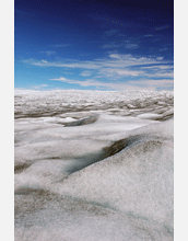 The edge of the Greenland ice sheet stretching off to the horizon